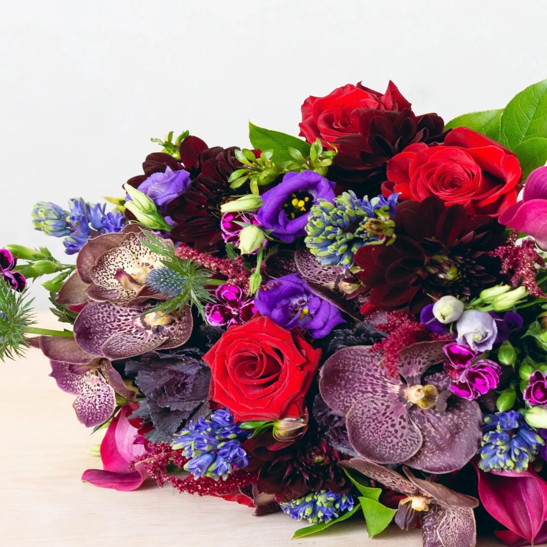 Colors that are vivid, bright, and rich. Depending on the season, the flowers featured will vary. Allow our designer to create a unique arrangement for your home or any occasion   NOTE: Blooms are delivered in a vase.