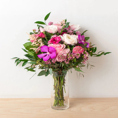 Our Handheld Tied Bouquet is created with the most beautiful pink blooms! Perfect for a party or while you're on the run!