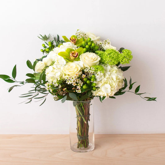 Our Handheld Tied Bouquet is created with the most beautiful white blooms! Perfect for a party or while you're on the run!