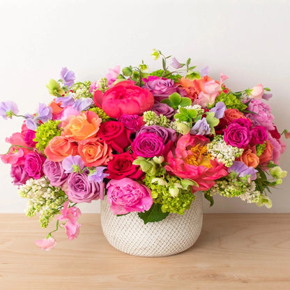 Newport Blossoms is an elegant arrangement full of the richest flowers that will make anyone fall in love.  Flower List:  Peonies  Roses  Sweet Pea  Lilac  Hellebores  Note: exact flowers will vary. Our team will always choose the freshest, most unique seasonal flower.