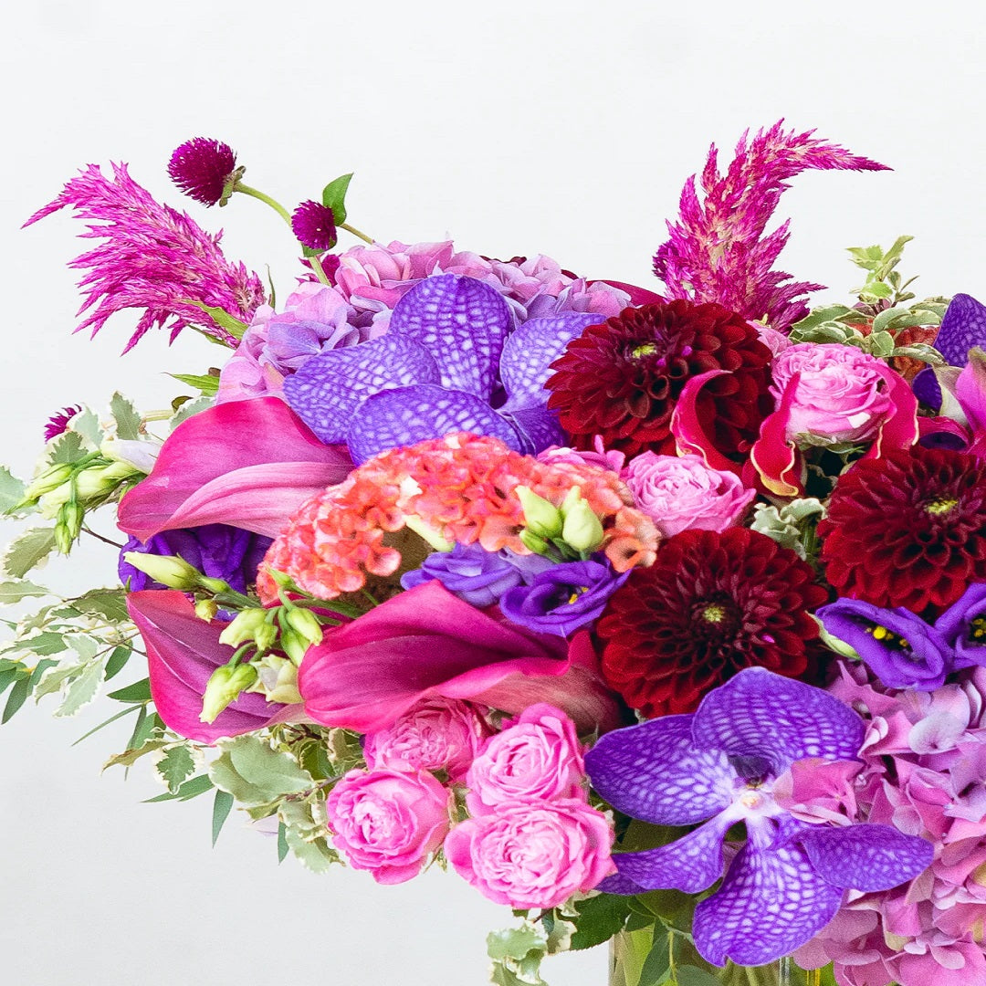 A lavish arrangement of lovely pink, purple, and red flowers. This bouquet will make the recipient's heart melt with pleasure, happiness, and love. It's a true show-stealer!